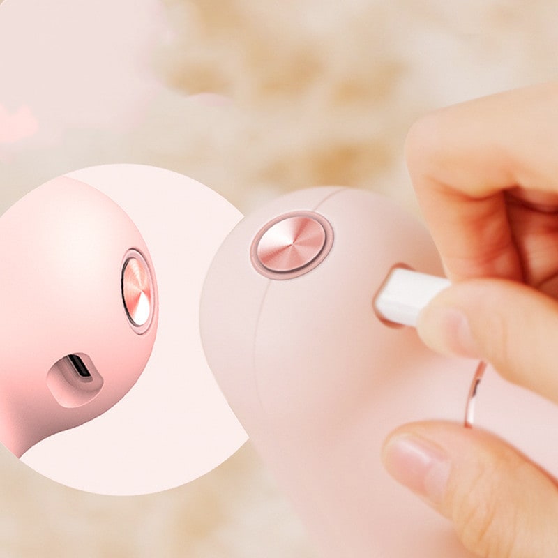 Mini Handheld Deep Tissue Massage Gun with Four Interchangeable Heads and Portable Cordless Design