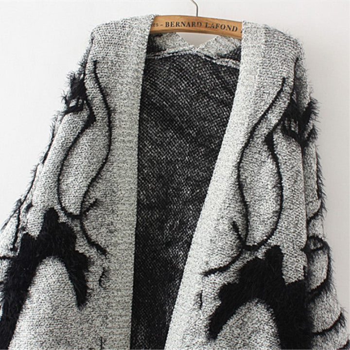 Women's knit dress with artistic graphic design and an elegant V-neck Chic and Style
