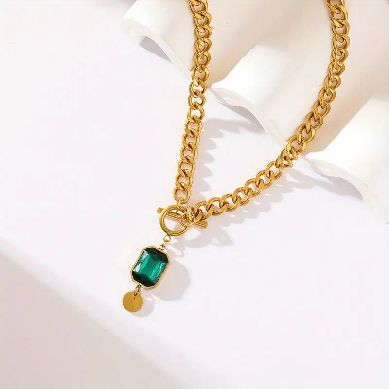 Elegant gold necklace with emerald pendant