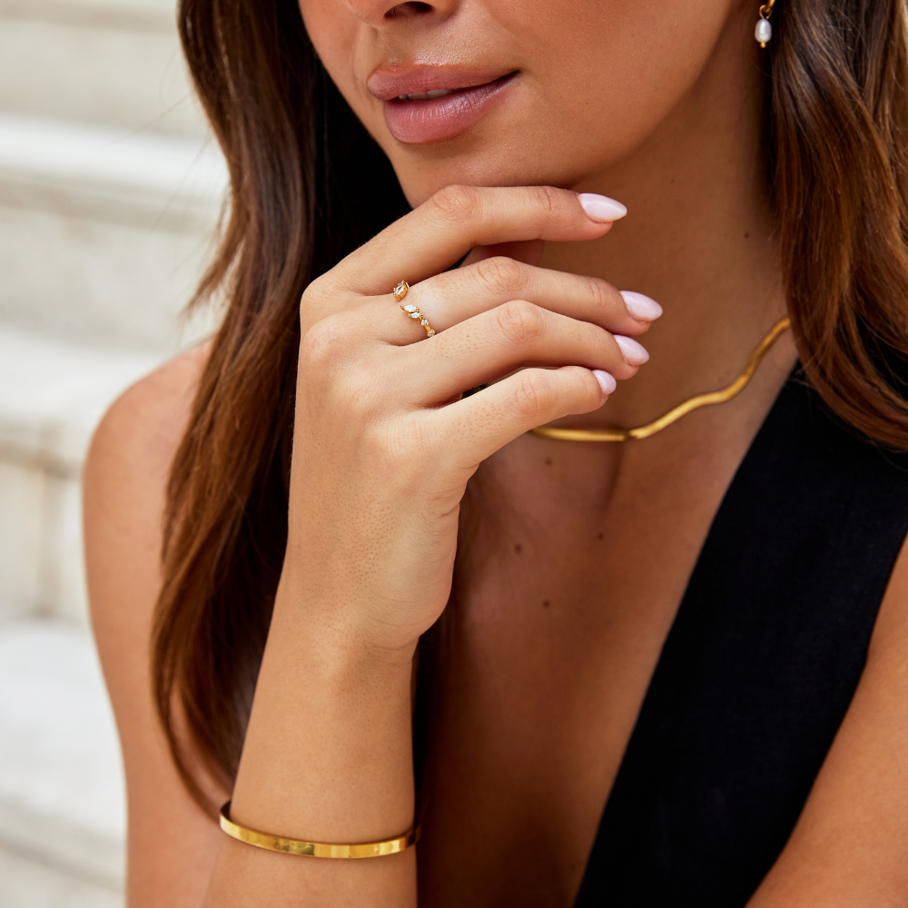 Refined gold ring with crystal accent