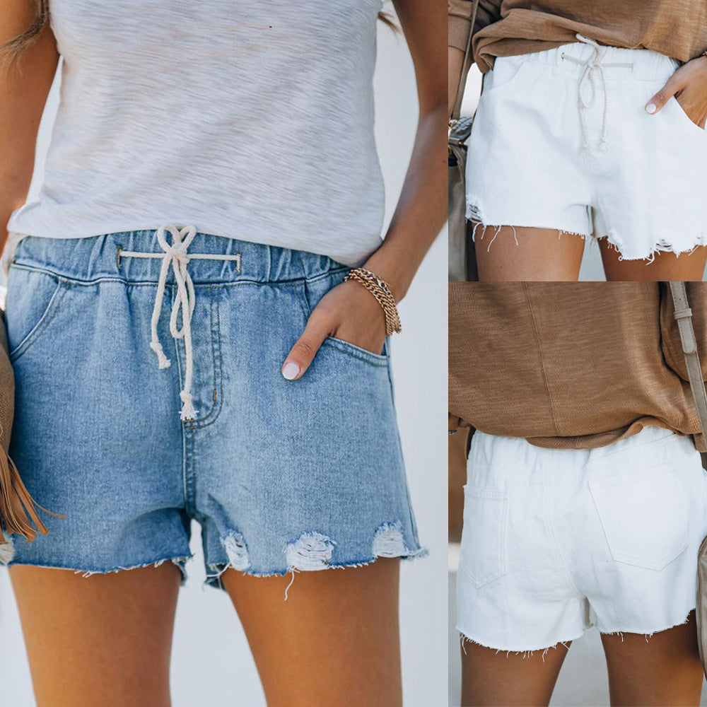 Women’s denim shorts with elastic waistband and frayed details Lune London