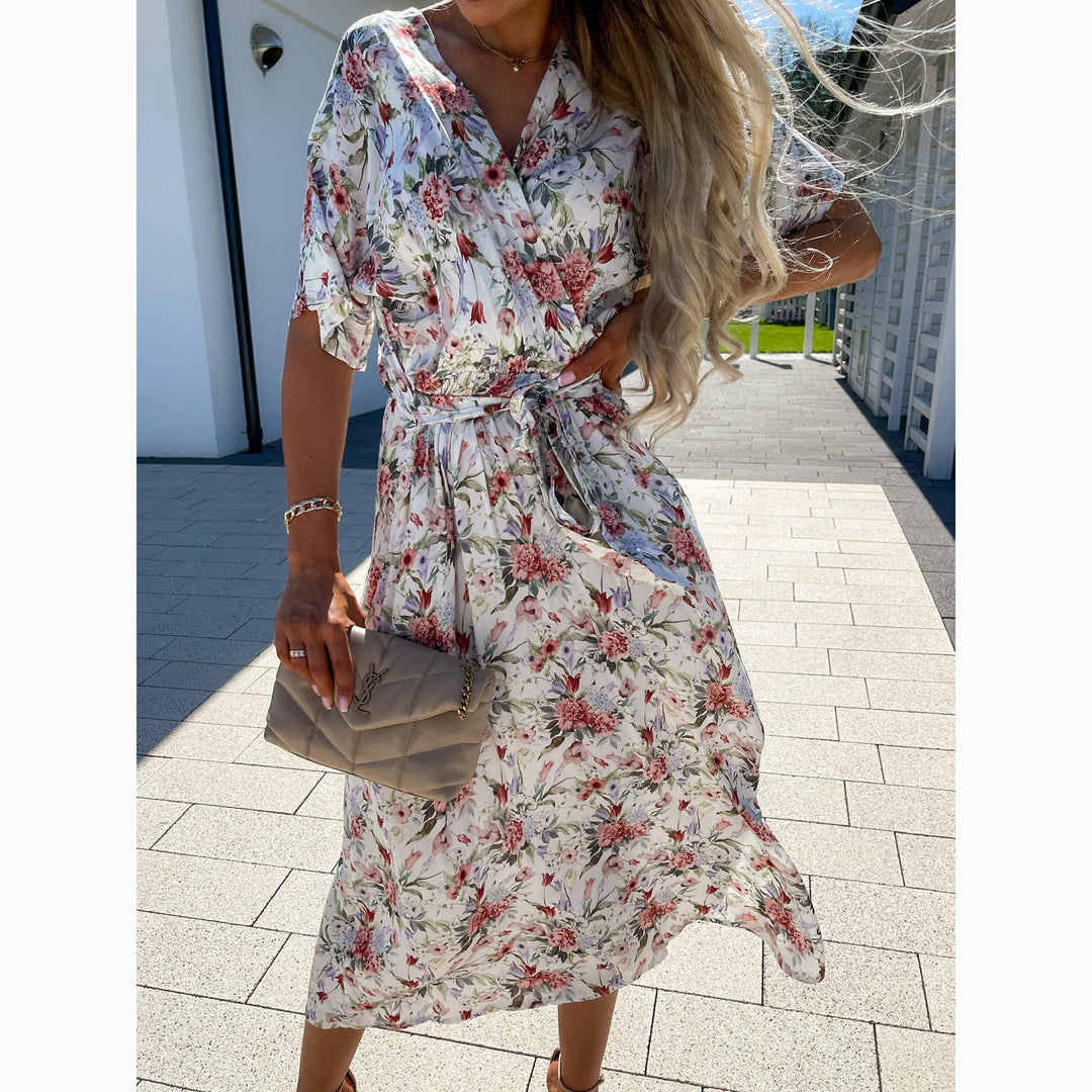 Women's wrap dress with floral pattern and waist belt