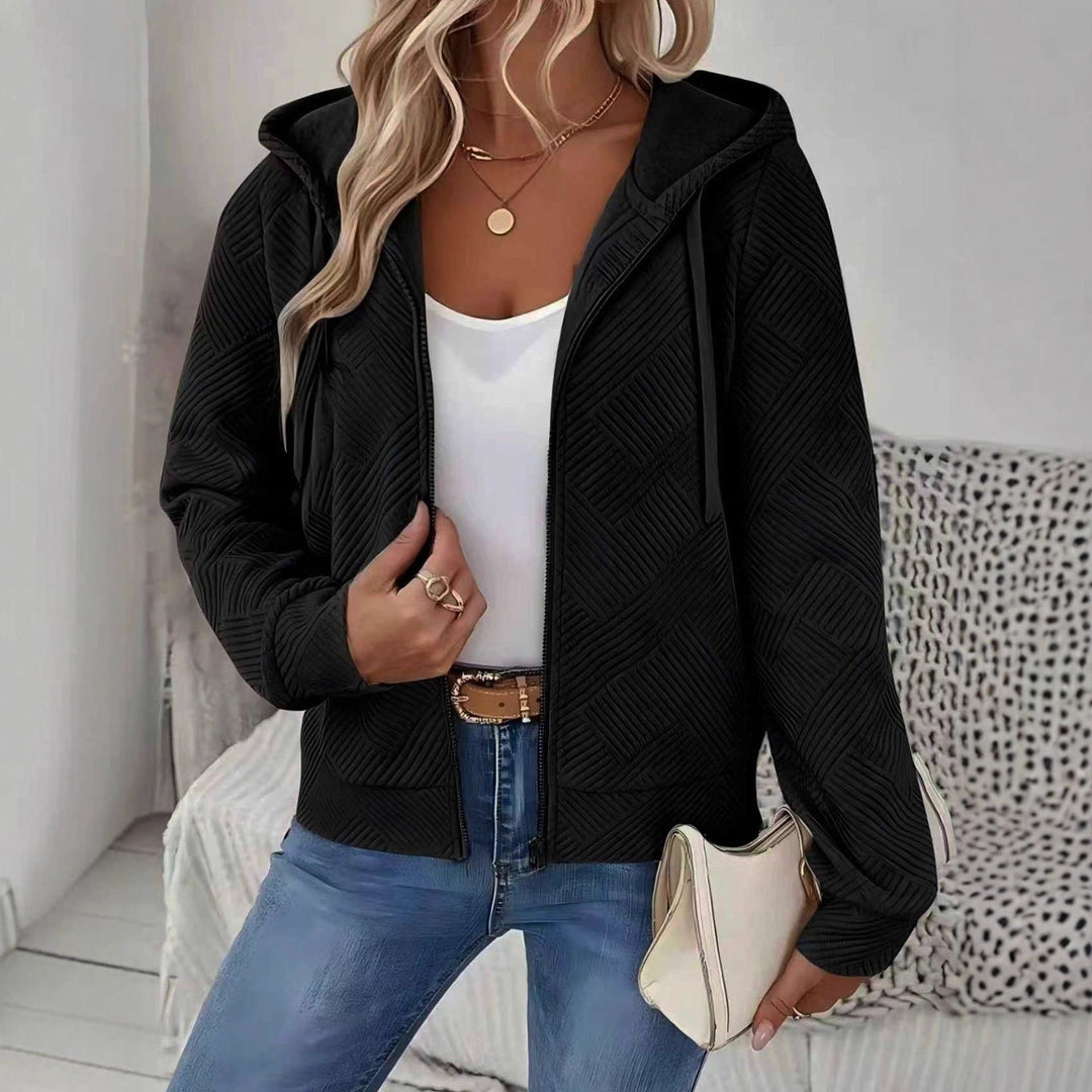 Veste à capuche sportive pour femmes avec design texturé et poches pratiques Chic & Stil