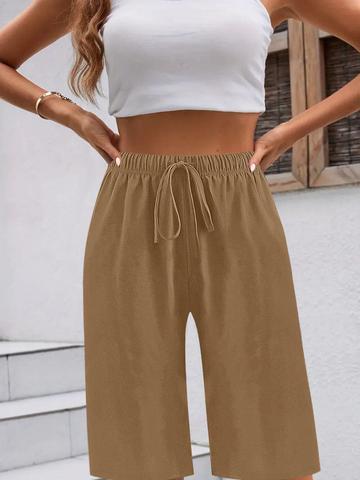 Comfortable women's sports shorts with elastic waistband and practical pocket design Lune London