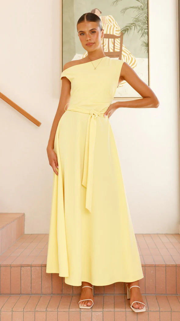 Women's maxi dress with a chic asymmetrical neckline and elegant bow