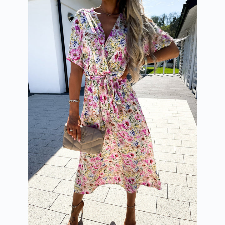 Women's wrap dress with floral pattern and waist belt