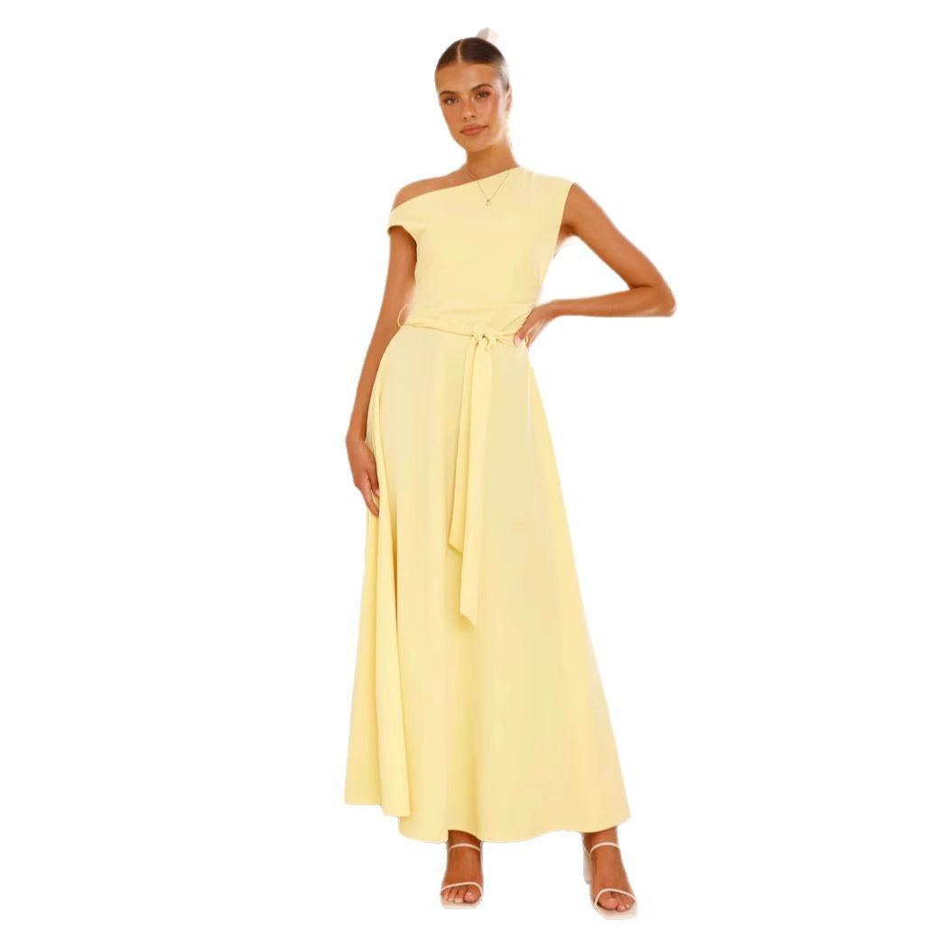Women's maxi dress with a chic asymmetrical neckline and elegant bow