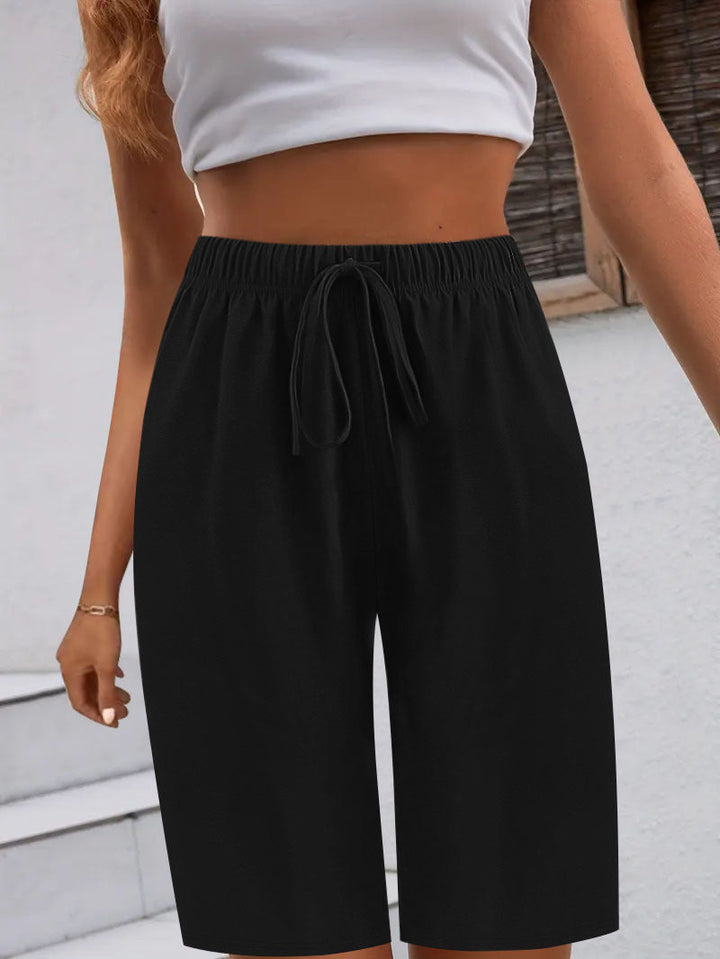 Comfortable women's sports shorts with elastic waistband and practical pocket design Lune London
