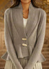 Women's knitted jacket with asymmetrical cut and decorative buttons