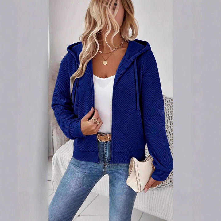 Veste à capuche sportive pour femmes avec design texturé et poches pratiques Chic & Stil