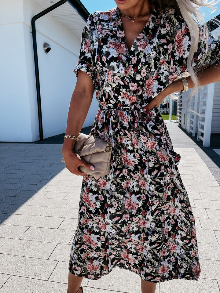 Women's wrap dress with floral pattern and waist belt