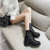 Women's platform boots with lace-up construction and sturdy profile