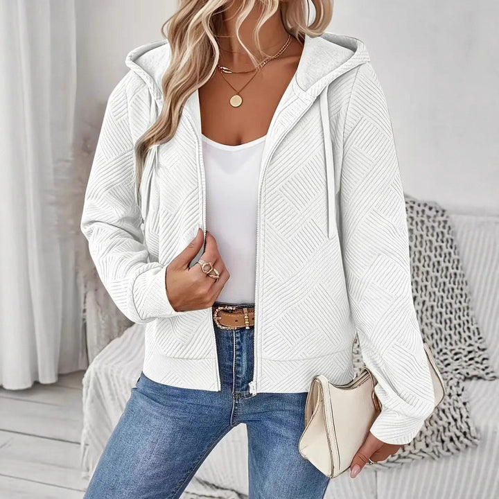 Veste à capuche sportive pour femmes avec design texturé et poches pratiques Chic & Stil