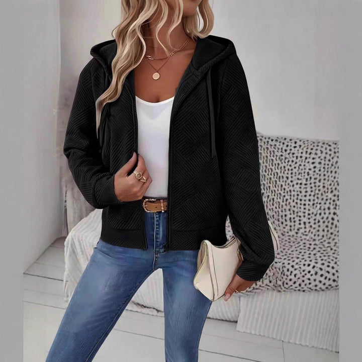 Veste à capuche sportive pour femmes avec design texturé et poches pratiques Chic & Stil