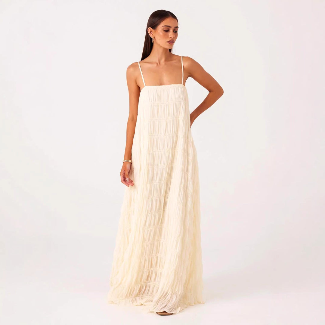 Women's maxi dress with romantic pleated structure and delicate spaghetti straps