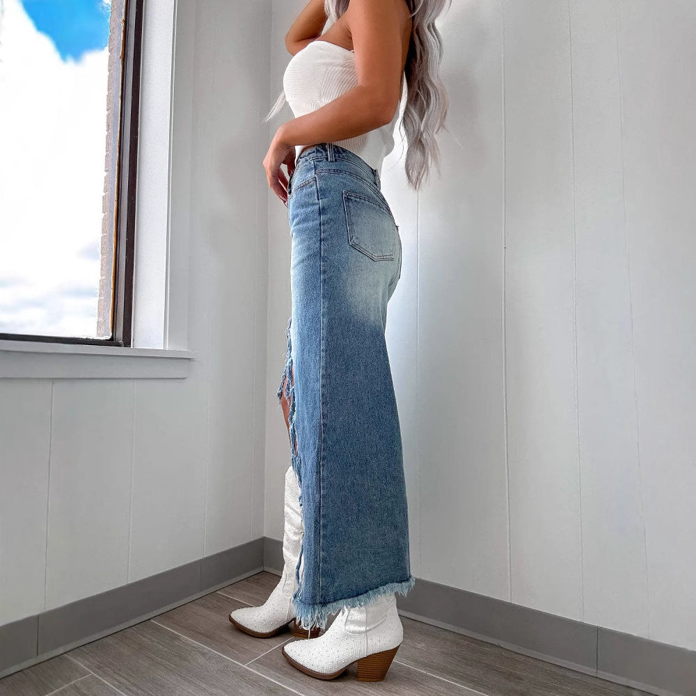 Women's mid-length denim skirt with partially frayed hem and high slit
