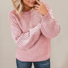 Thick knitted sweater for women with voluminous sleeves and a unique texture