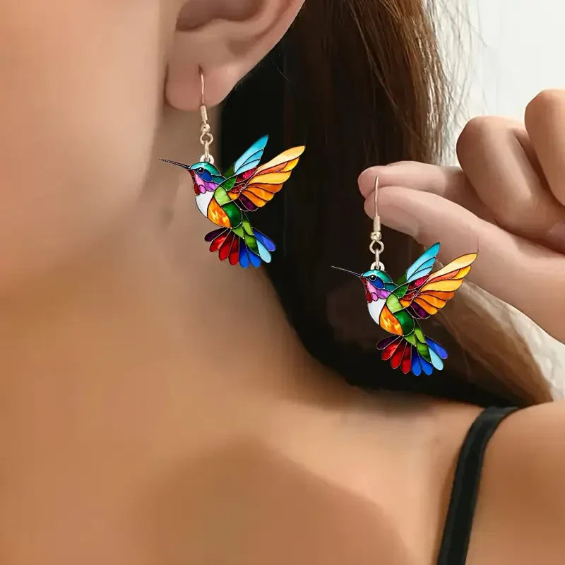 Elegant white gold earrings with colourful hummingbird
