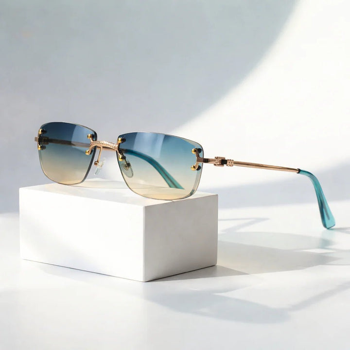 https://cdn.shopify.com/s/files/1/0943/0581/2804/files/sunglasses-rimless-gradient-lenses-uv400-protection-gold-2.jpg?v=1777615446